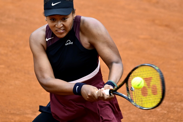 Osaka wins in Rome after three-year absence