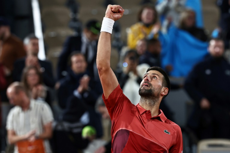 Djokovic shrugs off troubles in winning start at French Open
