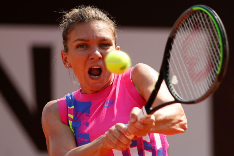 Top seed Halep eases into Italian Open third round