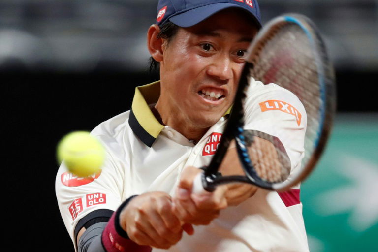 Nishikori finds feet on Rome clay with first win in a year