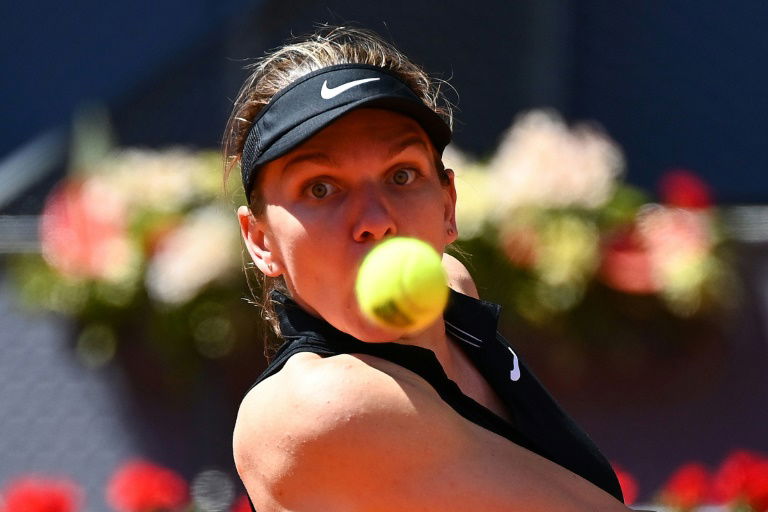 Halep knocked out of Madrid Open by Mertens
