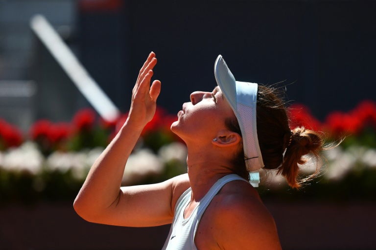 'Happy' Halep feeling less pressure at French Open