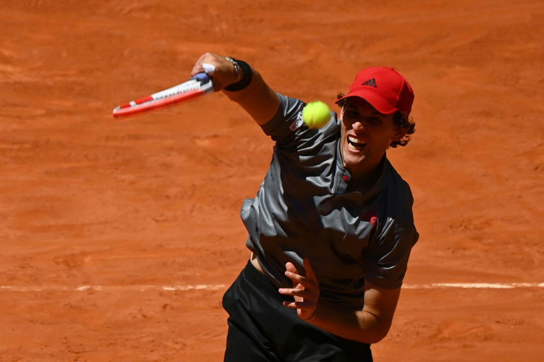 Thiem battles past Isner to reach semi-finals in Madrid