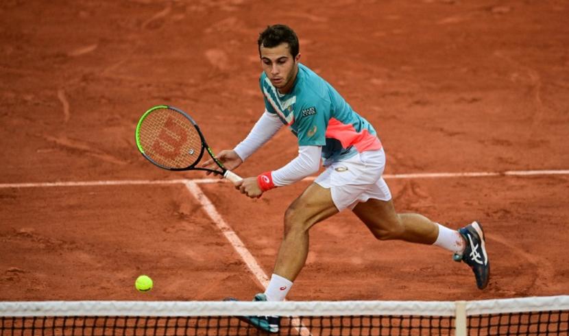 Gaston à l'oeuvre face à Thiem sur le Chatrier