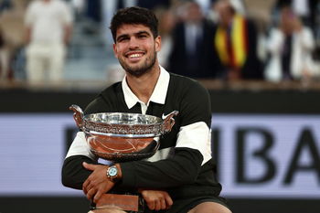 Alcaraz, the third player in the Open Era to win a Grand Slam after saving one or more match points  