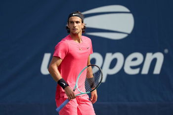 Musetti holds off Opelka to reach the second round