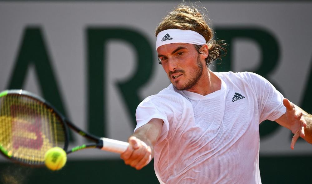 Tsitsipas beats Isner to join Carreno Busta in French Open 4th round