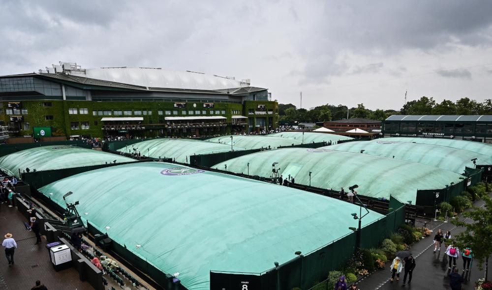 All matches officially postponed until Wednesday at Wimbledon.